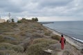 Typical Santorini Bay with Lady in Red and Sea View