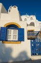 Typical Santorini house with white wall