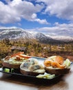 Typical Scandinavian sandwiches against small village on railroad from Flam to Myrdal in Norway