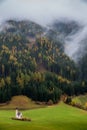 Typical scenery of Trentino Alto Adige South Tyrol in Italy in Dolomites Alps region during autumn with foliage and myst Royalty Free Stock Photo