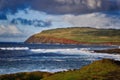 Rough cliffs and volcanic landscape on the coastline of pacific ocean, Easter Island Royalty Free Stock Photo
