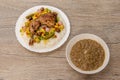 Typical Senegalese recipe for yassa with marinated spicy chicken, white rice and assorted pickles