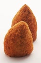 Two typical Sicilian arancini in a conical shape on a white background. Royalty Free Stock Photo