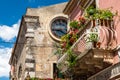 Typical Sicilian balcony in Taormina full of flowers and decorations Royalty Free Stock Photo