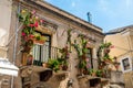 Typical Sicilian balcony in Taormina full of flowers and decorations Royalty Free Stock Photo