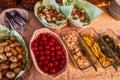 Typical side dishes for swiss cheese fondue with bred, potatoes and more Royalty Free Stock Photo