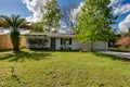 Typical Single Floor American House with Front Yard and Spacious Driveway Exterior Street View Royalty Free Stock Photo