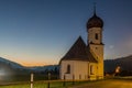 Typical small church in Austrian village Tannheim in Tyrol during dusk Royalty Free Stock Photo