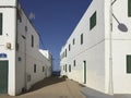 Typical small road with white colored house walls in Famara, Lanzarote