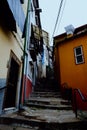 typical small street alleys with stairs and colorful buildings of the city Royalty Free Stock Photo