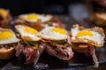 Typical snack of Basque Country and Navarre, pinchos or pinxtos served in bar, small slices of bread upon which ingredient or