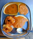 Typical south Indian breakfast consisting of thatte idli and vadas served with sambar and chutney