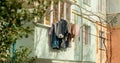 Typical soviet union block panel residential buildings exterior facade with clothes hang ouside. Royalty Free Stock Photo