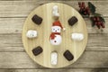 typical Spanish almond and almond and chocolate polvoron, mistletoe and Santa clock