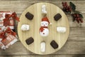 typical Spanish almond and almond and chocolate polvoron, mistletoe, Chritsmas presents and Santa clock