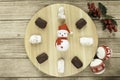 typical Spanish almond and almond and chocolate polvoron, mistletoe, Chritsmas balls and Santa clock