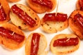 Typical spanish chorizo tapas. Pork sausage called chistorra on bread. Royalty Free Stock Photo