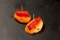 Typical spanish chorizo tapas. Pork sausage called chistorra on bread. Royalty Free Stock Photo