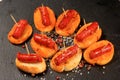 Typical spanish chorizo tapas. Pork sausage called chistorra on bread. Royalty Free Stock Photo