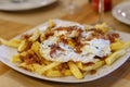 Typical Spanish food, fried eggs, chips and ham. Scrambled eggs