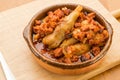 Typical Spanish food, lamb trotters with ham and chorizo.