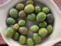 Typical spanish olives on beige plate Royalty Free Stock Photo