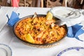 Typical Spanish paella with seafood ready to serve in restaurant