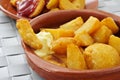 Typical spanish patatas bravas, fried potatoes with a hot sauce