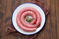 Typical spanish sausage on white dish on wooden background Royalty Free Stock Photo