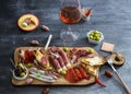 Typical spanish tapas concept. include variety slices jamon, chorizo, salami, bowls with olives, peppers. Copyspace. Royalty Free Stock Photo