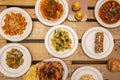 Typical Spanish tapas dishes with salad, vegetable stew, cod stew, golden cod, calamari in its ink, grilled chicken unvarnished