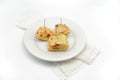 Typical spanish tortilla de patatas pintxo on a white background