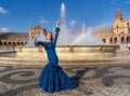 Typical Spanish woman dancing flamenco in Seville