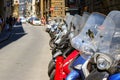 A typical street of Florence with motorcycle scooters parked in Royalty Free Stock Photo