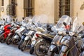 A typical street of Florence with motorcycle scooters parked in Royalty Free Stock Photo