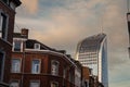 Typical street of Liege city center with residential buildings and the skyscraper of Tour Paradis, or Tour des Finances, a