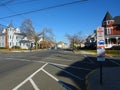 Typical Street in New Jersey with parked cars next to the sidewalk on a sunny day