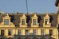 Typical street scene in the central of Poznan, old town with architecture facades of urban housing. Row of windows.