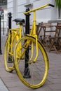 Yellow bicycle parked outside a coffee shop near Plac Nowy New Square in Kazimierz, the historic Jewish quarter of Krakow.