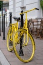 Yellow bicycle parked outside a coffee shop near Plac Nowy New Square in Kazimierz, the historic Jewish quarter of Krakow.
