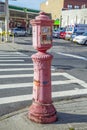 typical street scene with old victorian fire and police emergency telephone