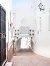 Street of white Andalusian village, spain, with beautiful flower pots, located on Mojacar, AlmerÃÂ­a Royalty Free Stock Photo