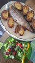 Typical summer dish in Finland with smoked fish, potatoes and fresh salad