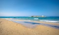 Typical summer image of an amazing pictorial view of a sandy beach and an old white church in a small isl