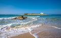 Typical summer image of an amazing pictorial view of a sandy beach and an old white church in a small isl