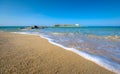 Typical summer image of an amazing pictorial view of a sandy beach and an old white church in a small isl