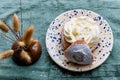 Typical Swedish semla with sweet cream on te blue textile Royalty Free Stock Photo