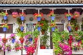 Typical Terrace (balcony) decorated Pink and Red Flowers, Spain Royalty Free Stock Photo