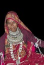 Typical Tharu dancer, wearing traditional jewelry and clothes, Nepal