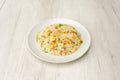 Typical three delicacies Chinese rice dish cooked in a restaurant with gisanstes, chopped scrambled eggs, ham Royalty Free Stock Photo